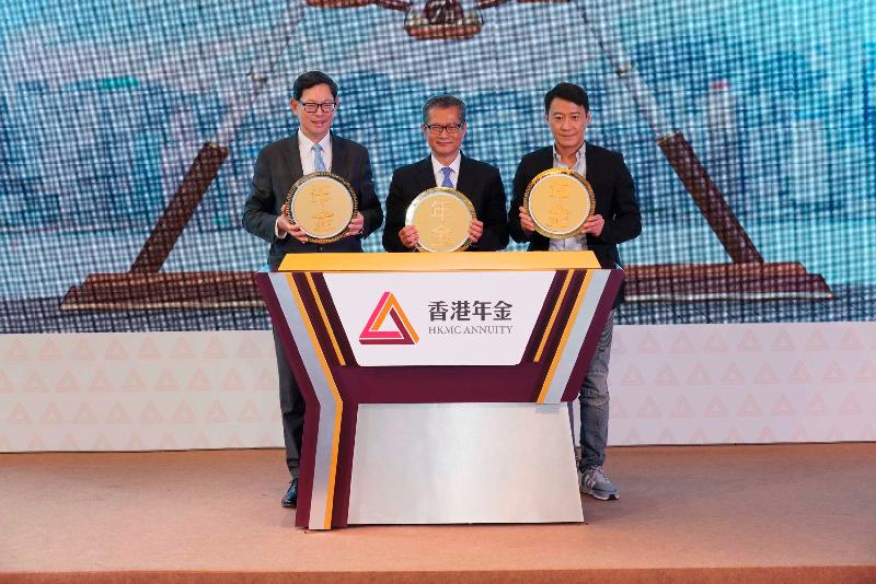 The Chairman of the Hong Kong Mortgage Corporation Limited (HKMC) and Financial Secretary, Mr Paul Chan (centre); the Chairman and Executive Director of HKMC Annuity Limited and Chief Executive of the Hong Kong Monetary Authority, Mr Norman Chan (left); and the promotional ambassador for life annuities, Leon Lai (right), officiate at the launch ceremony of the HKMC Annuity Plan today (July 5).
