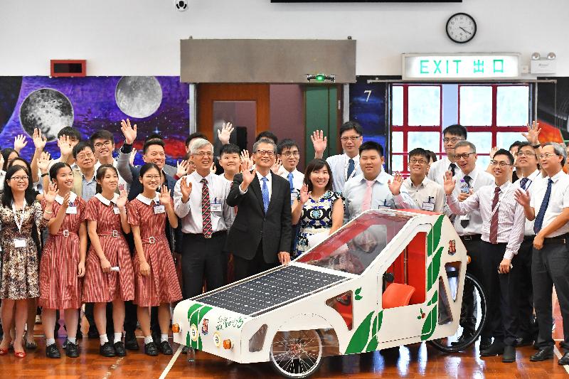 The Financial Secretary, Mr Paul Chan (front row, sixth left), accompanied by the District Officer (Tuen Mun), Ms Aubrey Fung (front row, seventh left), today (July 5) visited the Church of Christ in China Tam Lee Lai Fun Memorial Secondary School. Mr Chan is pictured with teachers and students there. 