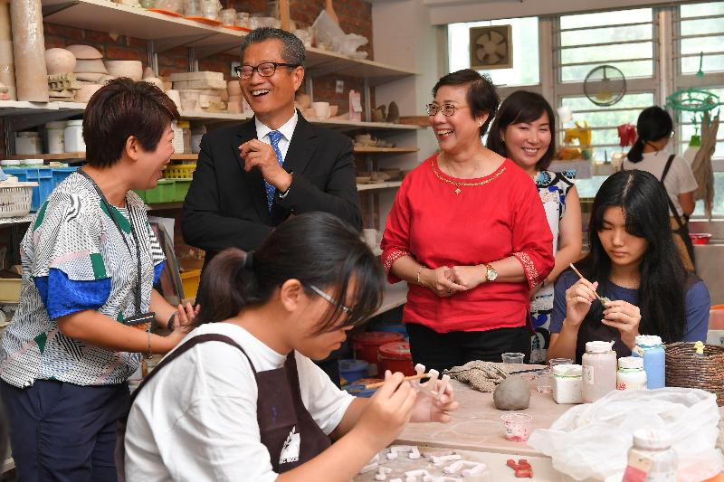 The Financial Secretary, Mr Paul Chan (fourth right), accompanied by the District Officer (Tuen Mun), Ms Aubrey Fung (second right), today (July 5) visits Free Methodist Church Tuen Mun Children and Youth Integrated Services Centre.