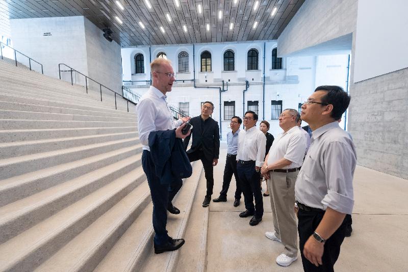 The Legislative Council (LegCo) Panel on Development visited Tai Kwun today (July 6). Photo shows LegCo Members, guided by the Director of Tai Kwun, Mr Timothy Calnin (first left), touring the Laundry Steps at Tai Kwun.