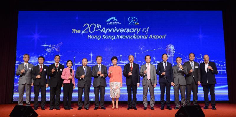The Chief Executive, Mrs Carrie Lam, attended a cocktail reception in celebration of the 20th anniversary of Hong Kong International Airport today (July 6). Photo shows Mrs Lam (centre); the Chairman of the Airport Authority Hong Kong (AA), Mr Jack So (sixth left); the Chief Executive Officer of the AA, Mr Fred Lam (fifth right); Chief Secretary for Administration, Mr Matthew Cheung Kin-chung (fifth left); the Secretary for Transport and Housing, Mr Frank Chan Fan (sixth right); and the Director-General of Civil Aviation, Mr Simon Li (fourth right) proposing a toast at the cocktail reception.