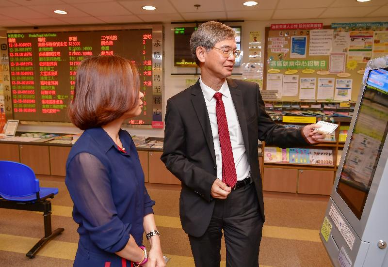 The Secretary for Labour and Welfare, Dr Law Chi-kwong, visited North Point Job Centre of the Labour Department this morning (July 19). Photo shows Dr Law (right) trying out the Job Easy touch-screen Vacancy Searching Terminal, which helps people to look for vacancies and apply for jobs.