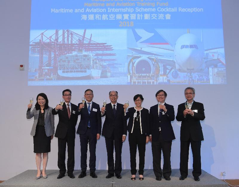 The Secretary for Transport and Housing, Mr Frank Chan Fan (centre), proposes a toast with guests in maritime and aviation sectors for welcoming students and thanking participating companies at the Maritime and Aviation Internship Scheme Cocktail Reception today (July 20). Also attending the reception are the Director-General of Civil Aviation, Mr Simon Li (third left), and the Director of Marine, Ms Maisie Cheng (third right).