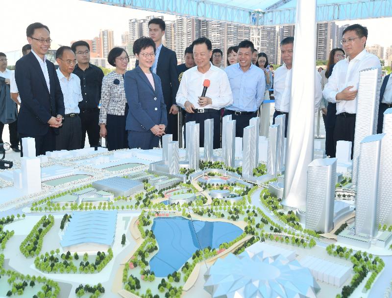 The Chief Executive, Mrs Carrie Lam, today (July 20) visited Shimao Shenzhen-Hong Kong International Center under planning in Longgang District, Shenzhen. Photo shows Mrs Lam (fifth left) receiving a briefing on the general planning of the project. Looking on are the Secretary for Constitutional and Mainland Affairs, Mr Patrick Nip (first left); the Director of the Hong Kong Economic and Trade Office in Guangdong of the Government of the Hong Kong Special Administrative Region, Mr Albert Tang (second left); the Secretary for Food and Health, Professor Sophia Chan (fourth left); and the Vice Mayor of the Shenzhen Municipal Government, Mr Wang Lixin (second right).