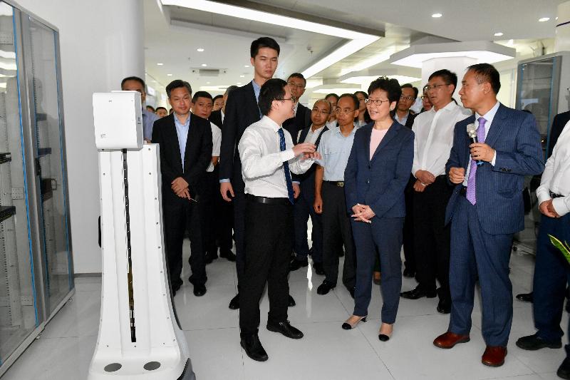 The Chief Executive, Mrs Carrie Lam, today (July 20) visited the Institute of Robotics and Intelligent Manufacturing of the Chinese University of Hong Kong, Shenzhen. Photo shows Mrs Lam (fourth right) and the President of the Chinese University of Hong Kong, Shenzhen, Mr Xu Yangsheng (first right), touring the exhibits. Looking on are the Secretary for Constitutional and Mainland Affairs, Mr Patrick Nip (third right), and the Director of the Hong Kong Economic and Trade Office in Guangdong of the Government of the Hong Kong Special Administrative Region, Mr Albert Tang (fifth right).