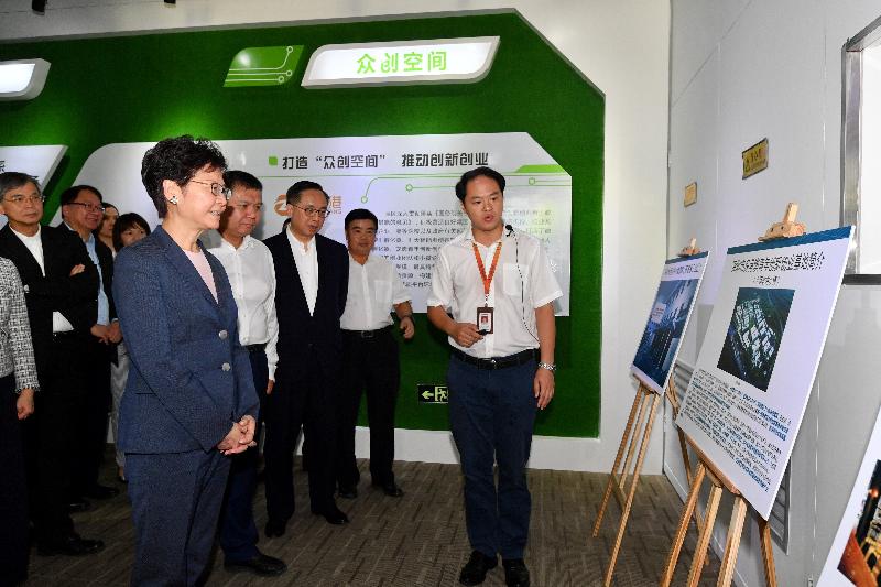 The Chief Executive, Mrs Carrie Lam, today (July 20) visited the exhibition hall of Software Town of Shenzhen Universiade in Longgang District, Shenzhen. Photo shows Mrs Lam (front row, first left) receiving a briefing on the development of the Software Town. Looking on are the Vice Mayor of the Shenzhen Municipal Government, Mr Wang Lixin (front row, second left); the Secretary for Innovation and Technology, Mr Nicholas W Yang (front row, third left); the Secretary for Labour and Welfare, Dr Law Chi-kwong (back row, first left); and the Director of the Chief Executive's Office, Mr Chan Kwok-ki (back row, second left).


