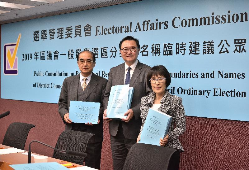 The Chairman of the Electoral Affairs Commission (EAC), Mr Justice Barnabas Fung Wah (centre), EAC members Mr Arthur Luk, SC (first left) and Professor Fanny Cheung (first right) present the public consultation documents on provisional recommendations on boundaries and names of constituencies for the 2019 District Council Ordinary Election at a press conference today (July 23).