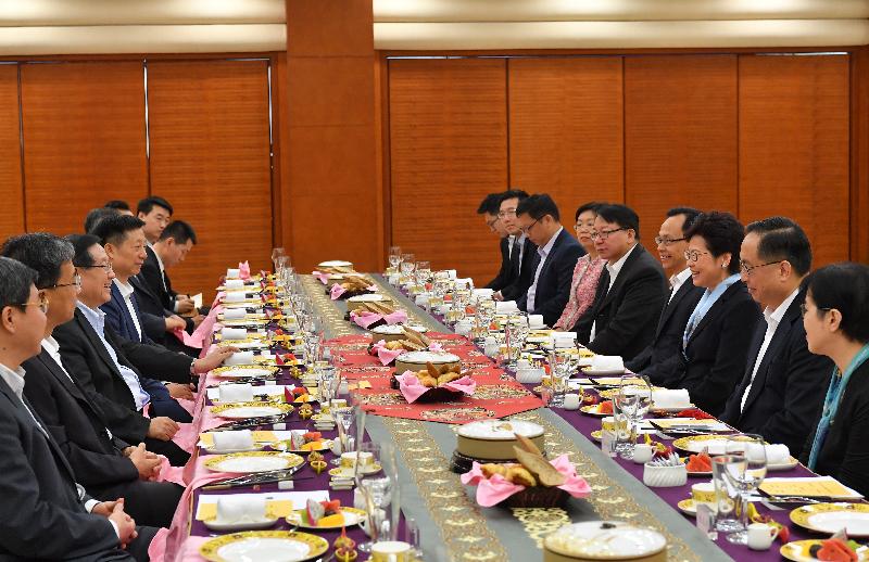 The Chief Executive, Mrs Carrie Lam (third right), had a breakfast meeting with Vice-Chairman of the National Committee of the Chinese People's Political Consultative Conference and President of the China Association for Science and Technology Professor Wan Gang (third left) in Beijing this morning (July 26). Also joining the meeting are the Secretary for Innovation and Technology, Mr Nicholas W Yang (second right); the Secretary for Constitutional and Mainland Affairs, Mr Patrick Nip (fourth right); the Director of the Chief Executive's Office, Mr Chan Kwok-ki (fifth right); the Director of the Office of the Government of the Hong Kong Special Administrative Region in Beijing, Ms Gracie Foo (sixth right); and the Commissioner for Innovation and Technology, Ms Annie Choi (first right).