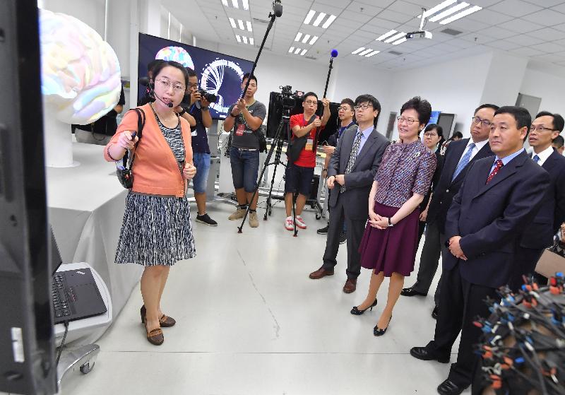 The Chief Executive, Mrs Carrie Lam visited the Institute of Automation of the Chinese Academy of Sciences (CASIA) today (July 26). Photo shows Mrs Lam (front row, second right); the President of the CASIA, Professor Xu Bo (front row, third right); Deputy President of the CASIA Mu Kexiong (front row, first right); the Secretary for Innovation and Technology, Mr Nicholas W Yang (back row, second right); and the Secretary for Constitutional and Mainland Affairs, Mr Patrick Nip (back row, first right) receiving a briefing on the scientific research achievements.
