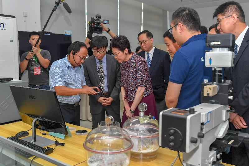The Chief Executive, Mrs Carrie Lam visited the Institute of Automation of the Chinese Academy of Sciences (CASIA) today (July 26). Photo shows Mrs Lam (third left); the President of the CASIA, Professor Xu Bo (second left); and the Secretary for Innovation and Technology, Mr Nicholas W Yang (fourth left) receiving a briefing on the scientific research achievements.