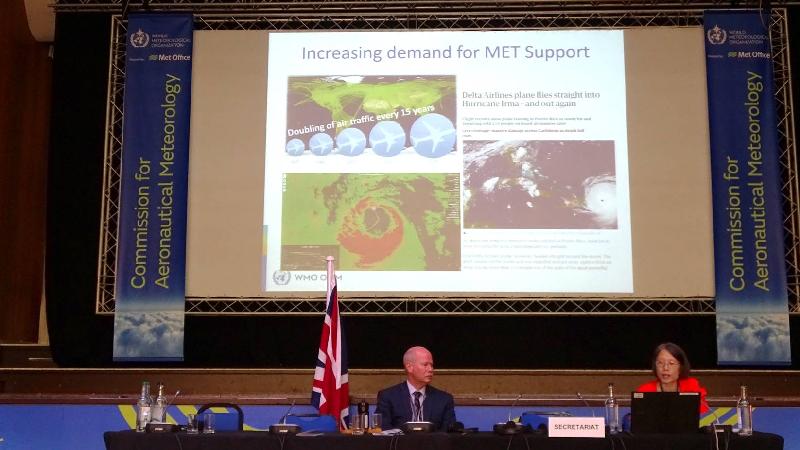 The Assistant Director of the Hong Kong Observatory, Ms Sharon Lau (right), introduces the importance of aircraft data to further development of aeronautical weather services at the 16th session of the Commission for Aeronautical Meteorology of the World Meteorological Organization held in Exeter, the United Kingdom, on July 25 (Exeter time).