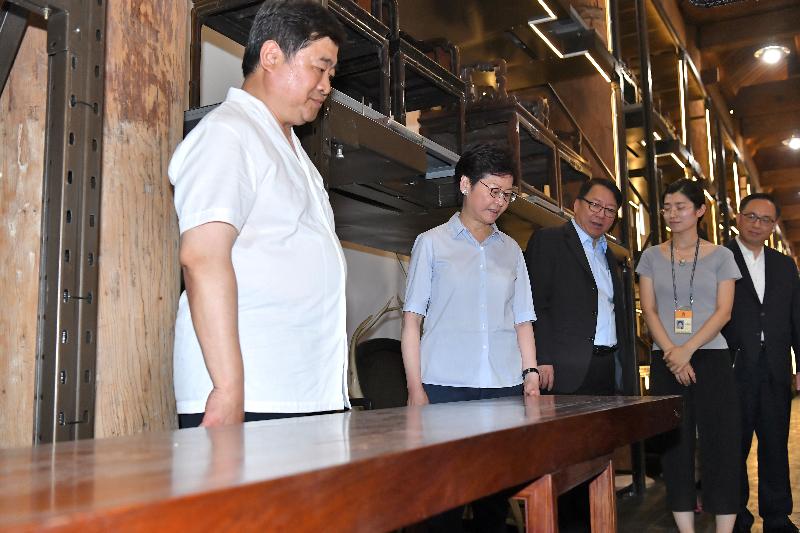 The Chief Executive, Mrs Carrie Lam, visited the Palace Museum in Beijing today (July 27). Photo shows Mrs Lam (second left), accompanied by the Director of the Palace Museum, Dr Shan Jixiang (first left), touring the Palace Museum Furniture Gallery. Also joining are the Secretary for Innovation and Technology, Mr Nicholas W Yang (first right), and the Director of the Chief Executive's Office, Mr Chan Kwok-ki (centre).