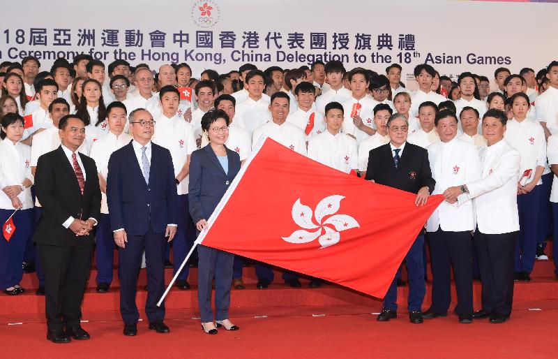 The Chief Executive, Mrs Carrie Lam (front row, third right), presents the Hong Kong Special Administrative Region flag to the President of the Sports Federation & Olympic Committee of Hong Kong, China (SF&OC), Mr Timothy Fok (front row, third right); the Chef de Mission of the Hong Kong, China Delegation to the 18th Asian Games, Mr Herman Hu (front row, second right); and the Honorary Secretary General of the SF&OC, Mr Ronnie Wong (front row, first right), at the Flag Presentation Ceremony for the Hong Kong, China Delegation to the 18th Asian Games at New Town Plaza, Sha Tin, today (July 29). Also present are the Secretary for Home Affairs, Mr Lau Kong-wah (front row, second left), and the Consul-General of the Republic of Indonesia in Hong Kong, Mr Tri Tharyat (front row, first left).