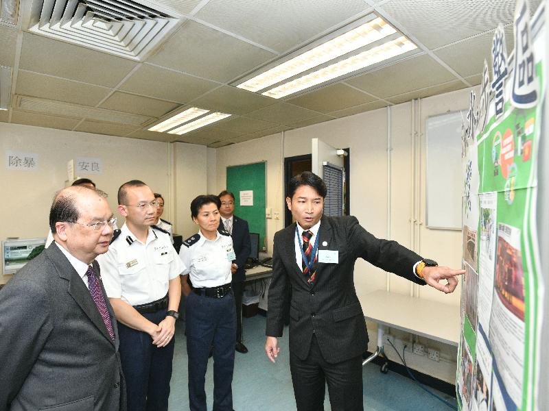The Chief Secretary for Administration, Mr Matthew Cheung Kin-chung (first left), visits Sham Shui Po Police Station today (July 31) and receives a briefing on the community policing of Sham Shui Po District.