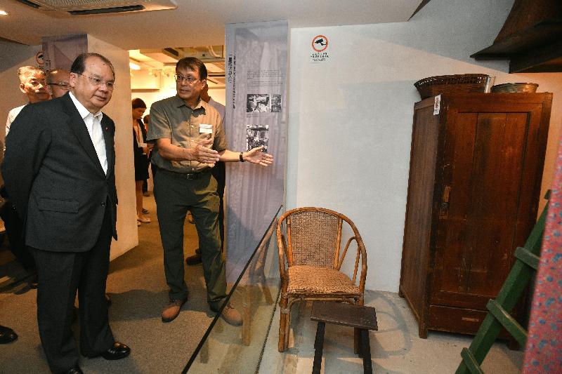 The Chief Secretary for Administration, Mr Matthew Cheung Kin-chung (first left), today (July 31) visits the Heritage of Mei Ho House museum and receives a briefing there.