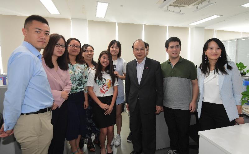 The Chief Secretary for Administration and Chairman of the Youth Development Commission (YDC), Mr Matthew Cheung Kin-chung; the Secretary for Home Affairs, Mr Lau Kong-wah; and YDC members visited Shenzhen today (August 10). Mr Cheung (third right) is pictured with YDC members and Hong Kong interns during a tour to a technology and innovation company in Qianhai.