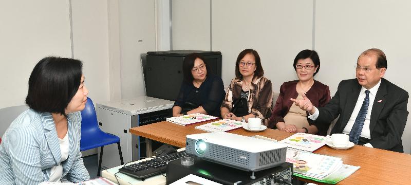 The Chief Secretary for Administration, Mr Matthew Cheung Kin-chung, today (August 14) visited the Wan Chai Elderly Health Centre. Photo shows Mr Cheung (first right), accompanied by the Director of Health, Dr Constance Chan (second right), receiving a briefing on the work of the Elderly Health Service.