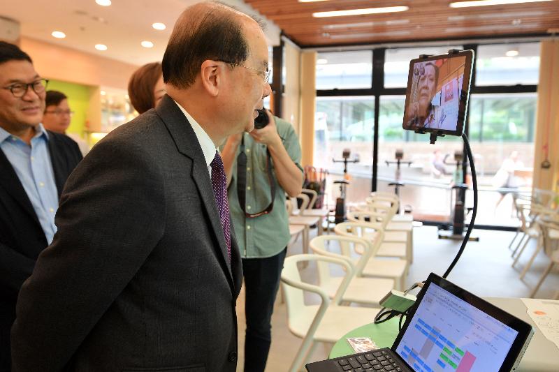 The Chief Secretary for Administration, Mr Matthew Cheung Kin-chung (second left), accompanied by the Chairman of the Central and Western District Council, Mr Yip Wing-shing (first left), today (August 17) visits the Hong Kong Sheng Kung Hui Western District Elderly Community Centre and learns about its facilities.