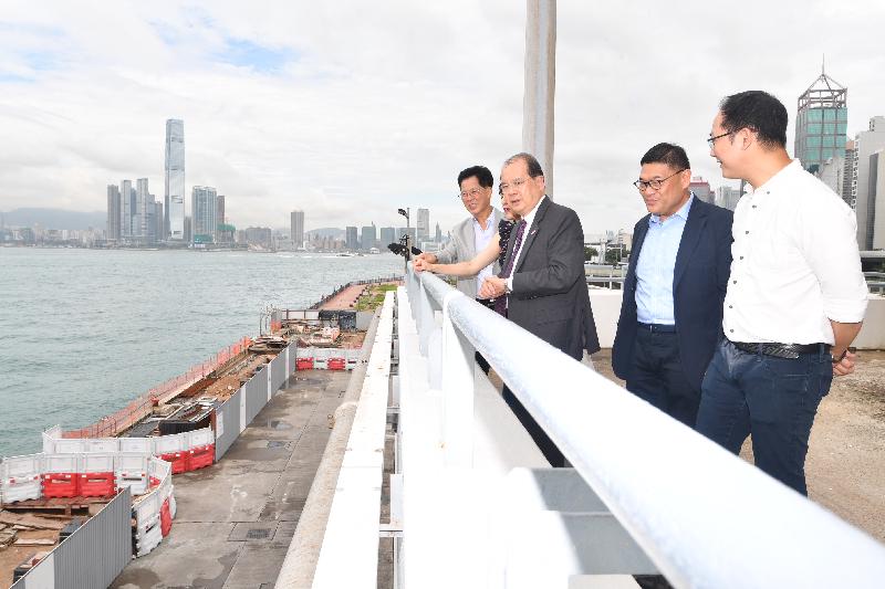 The Chief Secretary for Administration, Mr Matthew Cheung Kin-chung (third right), accompanied by the Chairman of the Central and Western District Council, Mr Yip Wing-shing (second right) and the Chairman of the Working Group on the Central and Western Harbourfront under the Central and Western District Council, Mr Chan Hok-fung (first right), today (August 17) inspects the Central and Western District Promenade - Western Wholesale Food Market Section to learn about the development of Central and Western District's harbourfront.