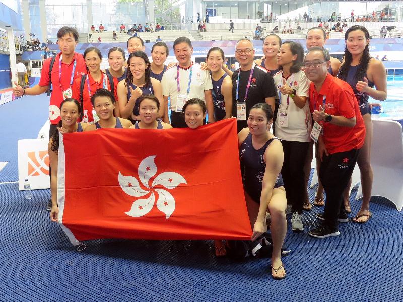The Secretary for Home Affairs, Mr Lau Kong-wah (second row, third right), today (August 20) watched a women's water polo match between Hong Kong and Japan at the Asian Games in Jakarta, Indonesia. Mr Lau is pictured with the Hong Kong women's water polo team after the match. 