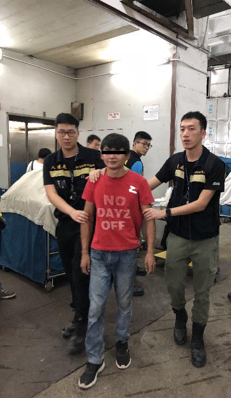 The Immigration Department mounted a territory-wide anti-illegal worker operation codenamed "Twilight" yesterday (August 23). Photo shows an illegal worker arrested during the operation.
