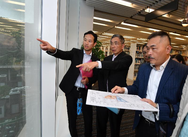 The Secretary for Financial Services and the Treasury, Mr James Lau (second left), visits Sai Kung District today (August 29) and is briefed by officers of the Government Property Agency on the progress of constructing government joint-user buildings at Area 67 in Tseung Kwan O.