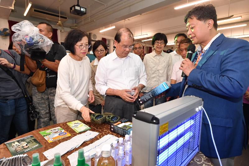 The Chief Secretary for Administration, Mr Matthew Cheung Kin-chung (centre), and the Secretary for Food and Health, Professor Sophia Chan (left), visited a secondary school in Cheung Chau today (August 30). Photo shows them being briefed by the principal on the mosquito control and prevention work in the school premises before the start of the new school year.