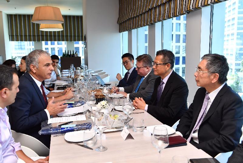 The Financial Secretary, Mr Paul Chan (second right), yesterday (September 5, Israel time) discussed matters of mutual interest with the Minister of Finance of Israel, Mr Moshe Kahlon (second left), at a luncheon in Tel Aviv. Also present were the Secretary for Financial Services and the Treasury, Mr James Lau (first right), and the Director-General of Investment Promotion, Mr Stephen Phillips (third right).