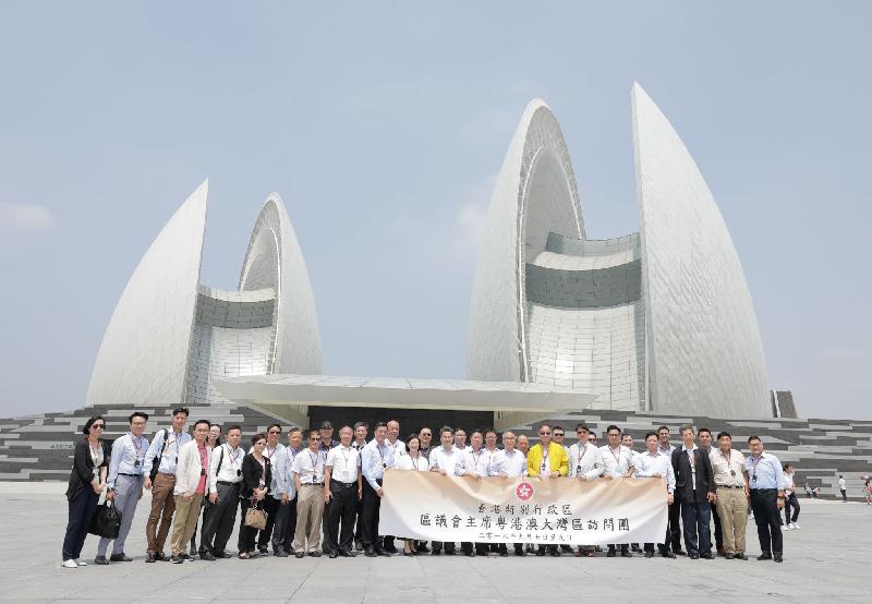 The Secretary for Home Affairs, Mr Lau Kong-wah (front row, eighth right), District Council chairmen and vice chairmen are pictured outside Zhuhai Grand Theatre during their visit to the Guangdong-Hong Kong-Macao Greater Bay Area today (September 9).