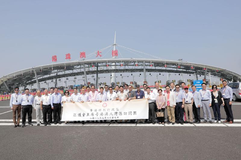 The Secretary for Home Affairs, Mr Lau Kong-wah (front row, eighth left), District Council chairmen and vice chairmen are pictured at the toll plaza of the Hong Kong-Zhuhai-Macao Bridge during their visit to the Guangdong-Hong Kong-Macao Greater Bay Area today (September 9).