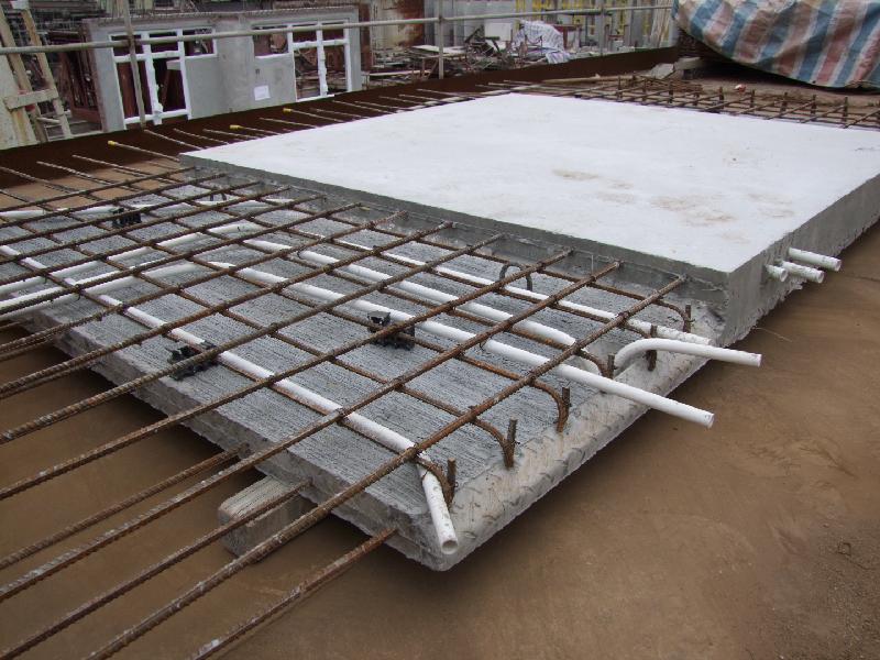 The Hong Kong Housing Authority increases use of precast concrete components and mechanised construction in its project. Photo shows a semi-precast slab.