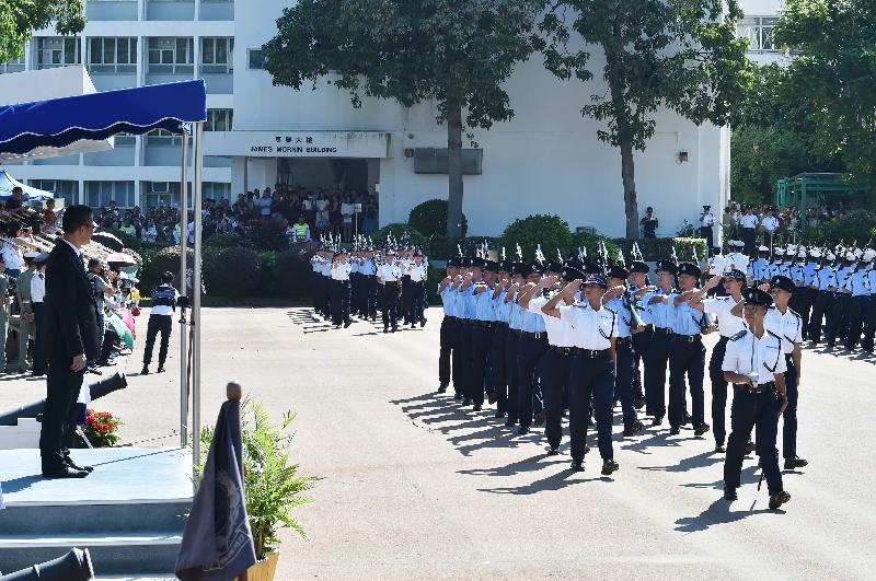 The Financial Secretary, Mr Paul Chan (first left), today (September 15) inspects a passing-out parade of 45 probationary inspectors and 230 recruit constables at the Hong Kong Police College.