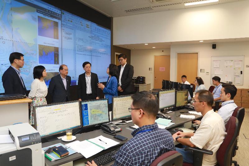 The Chief Secretary for Administration, Mr Matthew Cheung Kin-chung (third left), the Secretary for Security, Mr John Lee (fourth left), the Permanent Secretary for Security, Mrs Marion Lai (second left), and the Under Secretary for Security, Mr Sonny Au (first left), visit the Emergency Monitoring and Support Centre this afternoon (September 15) to have a better understanding of the mesaures taken by departments to deal with the influence of Super Typhoon Mangkhut.