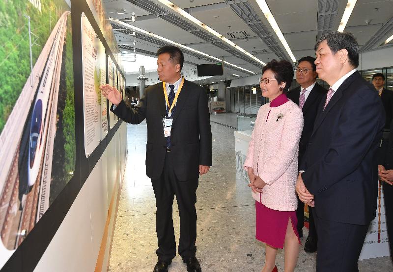 The Chief Executive, Mrs Carrie Lam, attended the Opening Ceremony for "Guangzhou-Shenzhen-Hong Kong" High Speed Rail (Hong Kong Section) held at the Hong Kong West Kowloon Station today (September 22). Photo shows (from second left) Mrs Lam; the Non-executive Chairman of the MTR Corporation, Professor Frederick Ma; and the General Manager of China Railway Corporation, Mr Lu Dongfu; receiving a briefing by the representative of China Railway Corporation on the development of high-speed rail in the Mainland.