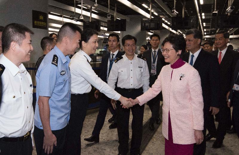The Chief Executive, Mrs Carrie Lam, attended the Opening Ceremony for "Guangzhou-Shenzhen-Hong Kong" High Speed Rail (Hong Kong Section) held at the Hong Kong West Kowloon Station today (September 22). Photo shows Mrs Lam (third right); the Governor of Guangdong Province, Mr Ma Xingrui (second right); and Vice-Chairman of the National Committee of the Chinese People's Political Consultative Conference Mr C Y Leung (first right), receiving a briefing on the operation of the Mainland Port Area.