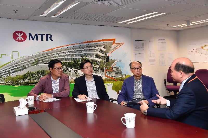 The Secretary for Security, Mr John Lee (second left), visited the Hong Kong Port Area of West Kowloon Station (WKS) after the service of the Hong Kong Section of the Guangzhou-Shenzhen-Hong Kong Express Rail Link (XRL) commenced today (September 23). Photo shows Mr Lee , the Secretary for Transport and Housing, Mr Frank Chan Fan (second right), and the Non-executive Chairman of MTR Corporation Limited (MTRCL), Professor Frederick Ma (first left), being briefed by the Chief of Operating (High Speed Rail) of MTRCL, Mr Francis Li (first right), on the operation of the XRL on its first day of service. 
