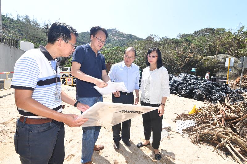 The Chief Secretary for Administration, Mr Matthew Cheung Kin-chung (second right), today (September 25) , accompanied by the Director of Leisure and Cultural Services, Ms Michelle Li (first right), is briefed on the damages brought about by the Super Typhoon Mangkhut and the repair work required at St. Stephen's Beach in Stanley.