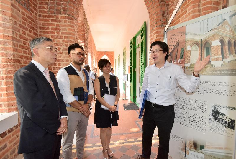 The Secretary for Financial Services and the Treasury, Mr James Lau (first left), visited the Antiquities and Monuments Office (AMO) today (September 28) to learn about how the former Kowloon British School has been preserved as the AMO head office. Also pictured are the Yau Tsim Mong District Council Chairman, Mr Chris Ip (second left) and the District Officer (Yau Tsim Mong), Mrs Laura Aron (second right). 