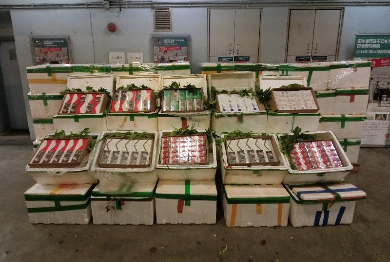 Hong Kong Customs seized about 800 000 suspected illicit cigarettes with an estimated market value of about $2.1 million and a duty potential of about $1.5 million at Man Kam To Control Point yesterday (September 29).