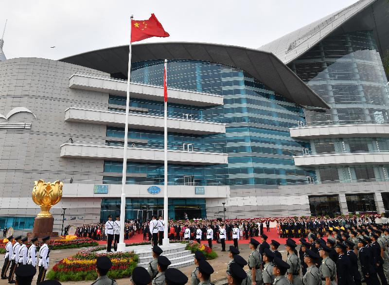 The Chief Executive, Mrs Carrie Lam, Principal Officials and guests attend the flag-raising ceremony in celebration of the 69th anniversary of the founding of the People's Republic of China at Golden Bauhinia Square in Wan Chai this morning (October 1).
