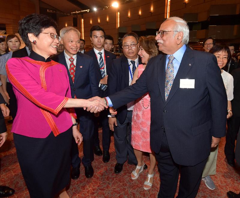 The Chief Executive, Mrs Carrie Lam (first left), greets a guest at a reception in celebration of the 69th anniversary of the founding of the People's Republic of China at the Grand Hall of the Hong Kong Convention and Exhibition Centre this morning (October 1).
