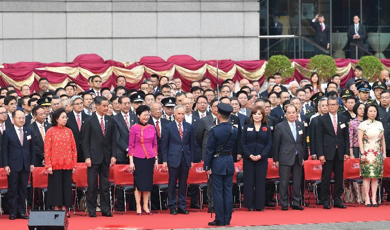 The Chief Executive, Mrs Carrie Lam (front row, fourth left), and her husband Dr Lam Siu-por (front row, fifth left); the Acting Chief Justice of the Court of Final Appeal, Mr Justice Ribeiro (front row, fifth right); former Chief Executive Mr C Y Leung (front row, third left) and his wife Mrs Regina Leung (front row, second left); the Chief Secretary for Administration, Mr Matthew Cheung Kin-chung (front row, third right); the Financial Secretary, Mr Paul Chan (front row, second right); the Secretary for Justice, Ms Teresa Cheng, SC (front row, first right); the Director of the Liaison Office of the Central People's Government in the Hong Kong Special Administrative Region, Mr Wang Zhimin (front row, first left), together with senior government officials and guests, attend the flag-raising ceremony in celebration of the 69th anniversary of the founding of the People's Republic of China at Golden Bauhinia Square in Wan Chai this morning (October 1).