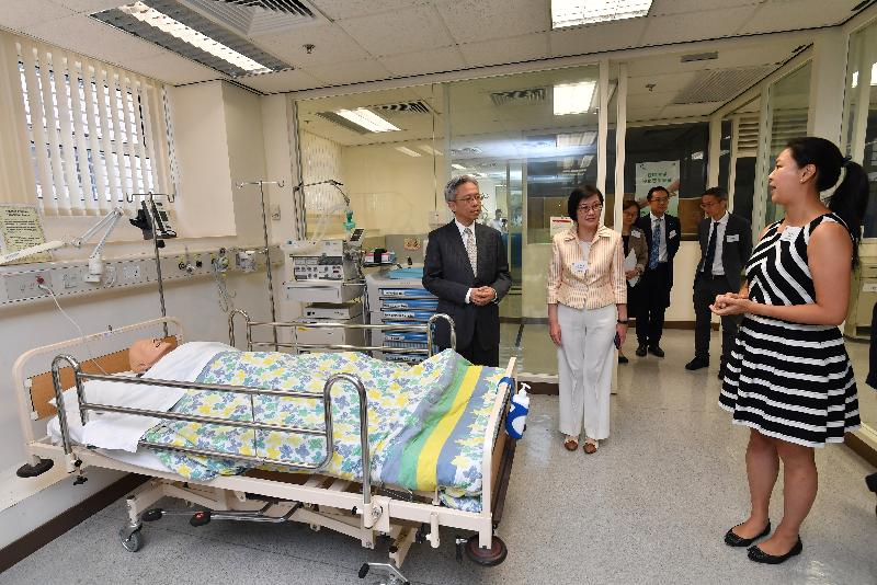 The Secretary for the Civil Service, Mr Joshua Law, visited the Centre for Health Protection of the Department of Health today (October 2). Photo shows Mr Law (first left) touring the simulation ward of the Infection Control Branch, which was purpose-built for providing infection control training to health care professionals. Looking on is the Director of Health, Dr Constance Chan (second left).