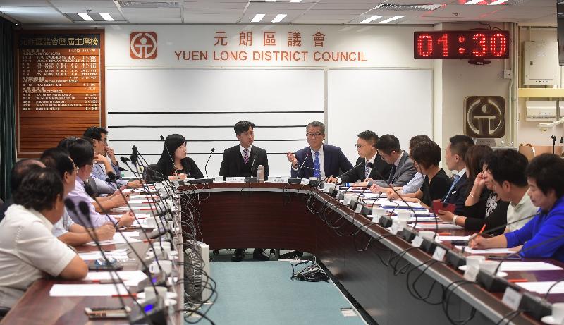 The Financial Secretary, Mr Paul Chan (third left), today (October 3), accompanied by the District Officer (Yuen Long), Mr Enoch Yuen (fourth left), meets with the Chairman of the Yuen Long District Council (YLDC), Mr Shum Ho-kit (second left), and other members of the YLDC to learn more about the latest developments of the district, and to exchange views on matters of mutual interest.