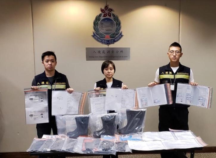 The Immigration Department mounted a territory-wide anti-illegal worker operation codenamed "Twilight" from October 2 to 4. Photo shows officers holding items seized during the operation.