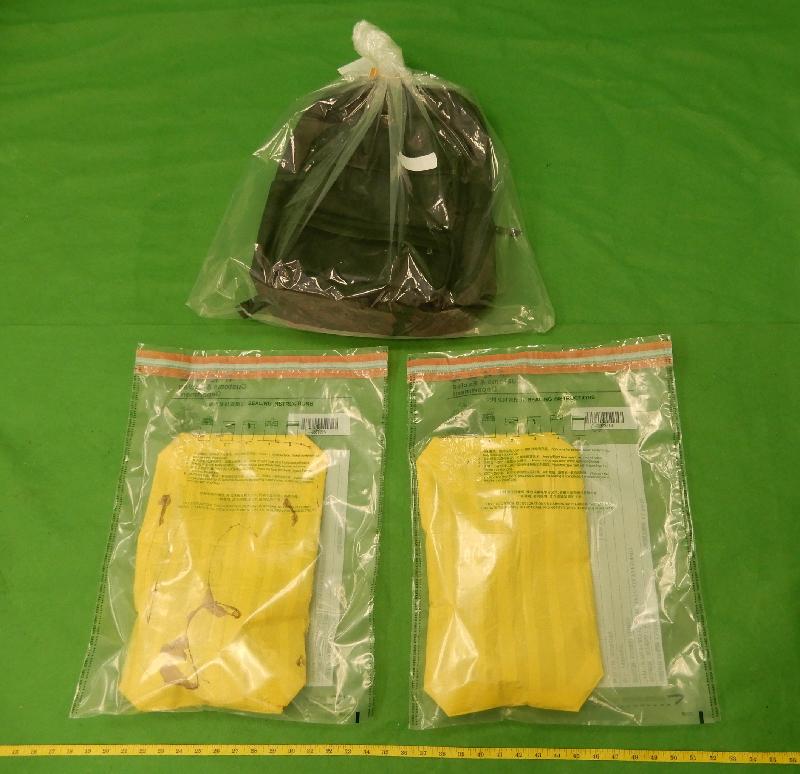 Hong Kong Customs yesterday (October 6) seized about 2.1 kilograms of suspected cocaine with an estimated market value of about $2.2 million at Hong Kong International Airport.  The suspected cocaine was found inside false compartments of a rucksack of a male passenger. 