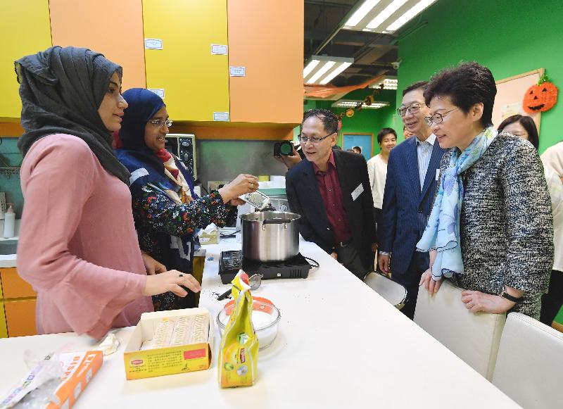 The Chief Executive, Mrs Carrie Lam, visited the LINK Support Service Centre for Ethnic Minorities (LINK Centre) to introduce to them support measures for ethnic minorities in the Policy Address and inspected the site of the District Health Centre in Kwai Tsing District in the morning today (October 13). Picture shows Mrs Lam (first right) chatting with the ethnic minorities in the LINK Centre. 