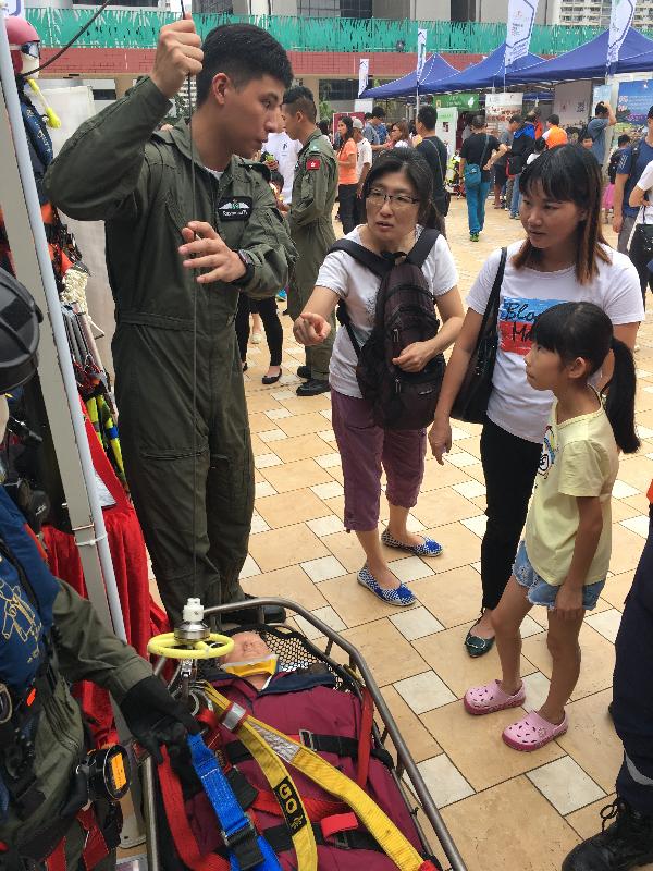 The Civil Aid Service held the Mountaineering Safety Promotion Day 2018 with various government departments and mountaineering organisations today (October 14) at Tuen Mun Cultural Square. Photo shows members of the public viewing the advanced mountaineering equipment on display at the event.