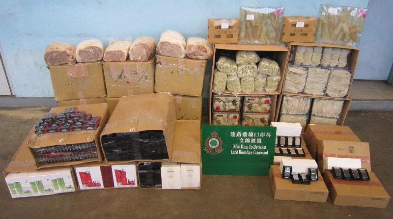 Hong Kong Customs seized a batch of suspected smuggled goods, including about 176 kilograms of frozen beef, about 38kg of bird nest, about 3kg of fish maw and five cartons of cosmetics with an estimated market value of about $1.8 million at Man Kam To Control Point on October 13.