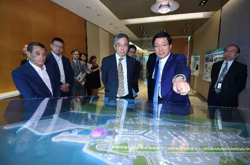 The Secretary for Financial Services and the Treasury, Mr James Lau (centre), visited the Hong Kong International Airport Tower today (October 15) and was briefed by Chief Executive Officer of Airport Authority Hong Kong, Mr Fred Lam (second right), on the construction progress of the Three-runway System and SKYCITY.